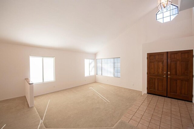 2432 Live Oak Rd, Escondido, CA 92029 - foyer entrance with high vaulted ceiling, light colored carpet, and baseboards