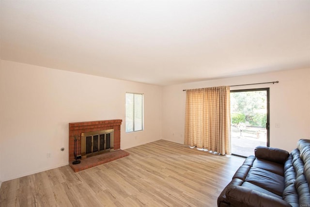 2432 Live Oak Rd, Escondido, CA 92029 - living room featuring light wood finished floors and a fireplace