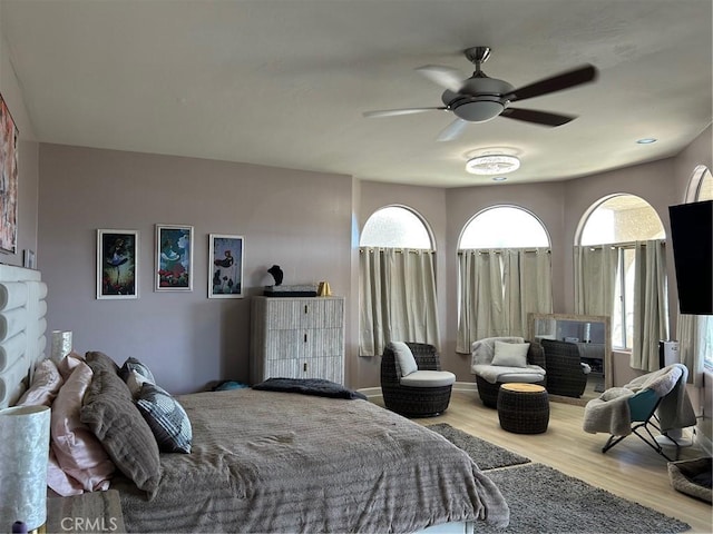 28856 Yosemite Pl, Canyon Lake, CA 92587 - bedroom with wood finished floors, multiple windows, and a ceiling fan