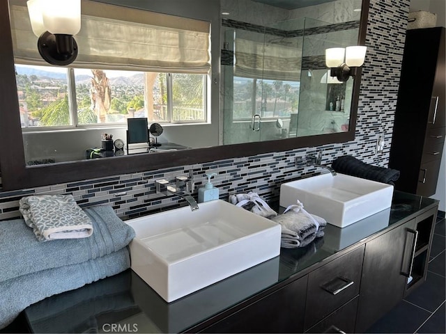 28856 Yosemite Pl, Canyon Lake, CA 92587 - full bathroom featuring tasteful backsplash, a shower stall, vanity, and tile walls