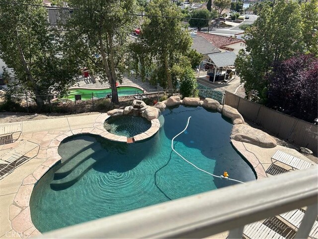 28856 Yosemite Pl, Canyon Lake, CA 92587 - view of pool featuring a pool with connected hot tub and a patio area