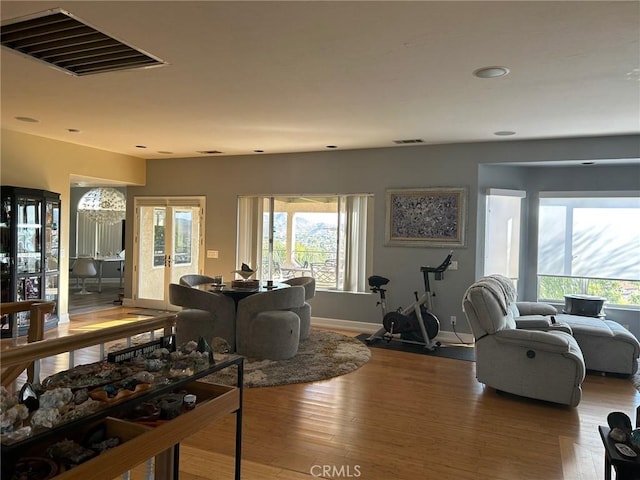 28856 Yosemite Pl, Canyon Lake, CA 92587 - living area with healthy amount of natural light, wood finished floors, and recessed lighting