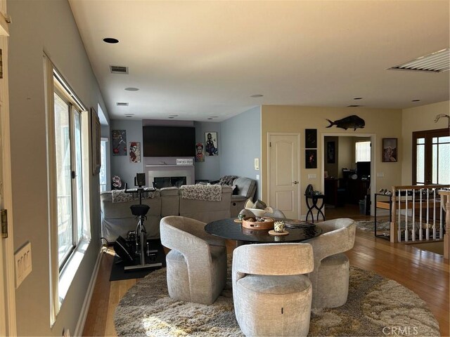 28856 Yosemite Pl, Canyon Lake, CA 92587 - dining area with wood finished floors and a fireplace