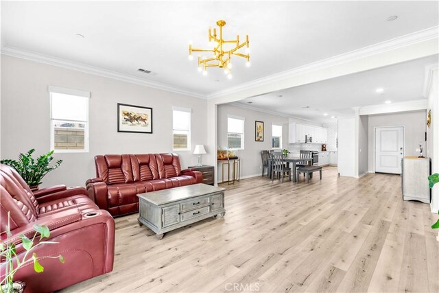 living room featuring a chandelier, light wood finished floors, crown molding, recessed lighting, and baseboards