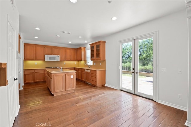 5176 Glenview St, Chino Hills, CA 91709 - kitchen featuring white microwave, a sink, light wood finished floors, light countertops, and recessed lighting