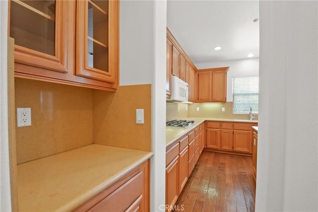 5176 Glenview St, Chino Hills, CA 91709 - kitchen with white microwave, light wood-type flooring, light countertops, glass insert cabinets, and recessed lighting