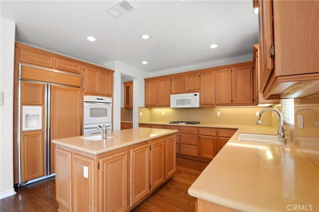 5176 Glenview St, Chino Hills, CA 91709 - kitchen featuring a sink, white appliances, a center island with sink, dark wood-style flooring, and recessed lighting