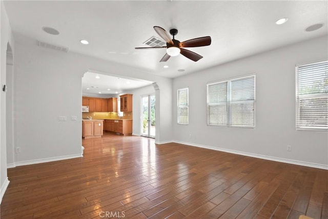 5176 Glenview St, Chino Hills, CA 91709 - unfurnished living room featuring ceiling fan, hardwood / wood-style flooring, baseboards, recessed lighting, and arched walkways