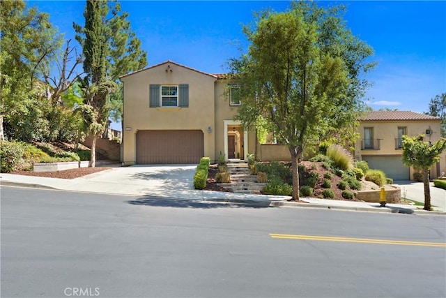 5176 Glenview St, Chino Hills, CA 91709 - mediterranean / spanish-style home featuring an attached garage, concrete driveway, and stucco siding