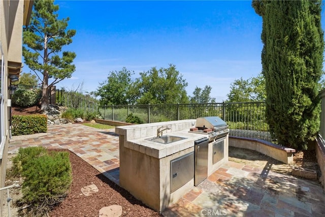 5176 Glenview St, Chino Hills, CA 91709 - view of patio featuring a sink, an outdoor kitchen, fence, and grilling area