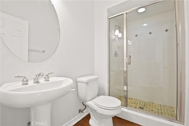 5176 Glenview St, Chino Hills, CA 91709 - bathroom featuring a stall shower, toilet, wood finished floors, baseboards, and a sink
