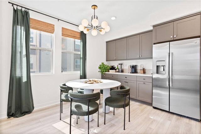 1201 Lasso Way Unit 202, Rancho Mission Viejo, CA 92694 - kitchen featuring stainless steel fridge, gray cabinets, a chandelier, light wood-style floors, and recessed lighting