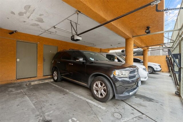 1061 Dawson Ave, Long Beach, CA 90804 - parking garage featuring a garage door opener