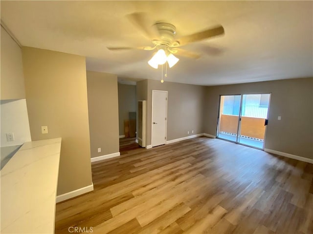 1061 Dawson Ave, Long Beach, CA 90804 - empty room with a ceiling fan, wood finished floors, and baseboards