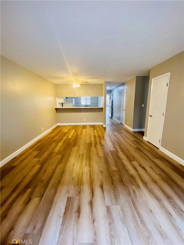 1061 Dawson Ave, Long Beach, CA 90804 - unfurnished living room with wood finished floors and baseboards