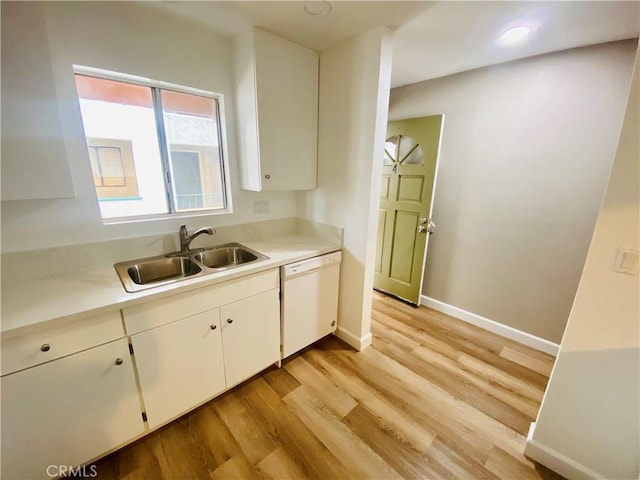 1061 Dawson Ave, Long Beach, CA 90804 - kitchen with a sink, dishwasher, light wood-style flooring, light countertops, and white cabinetry