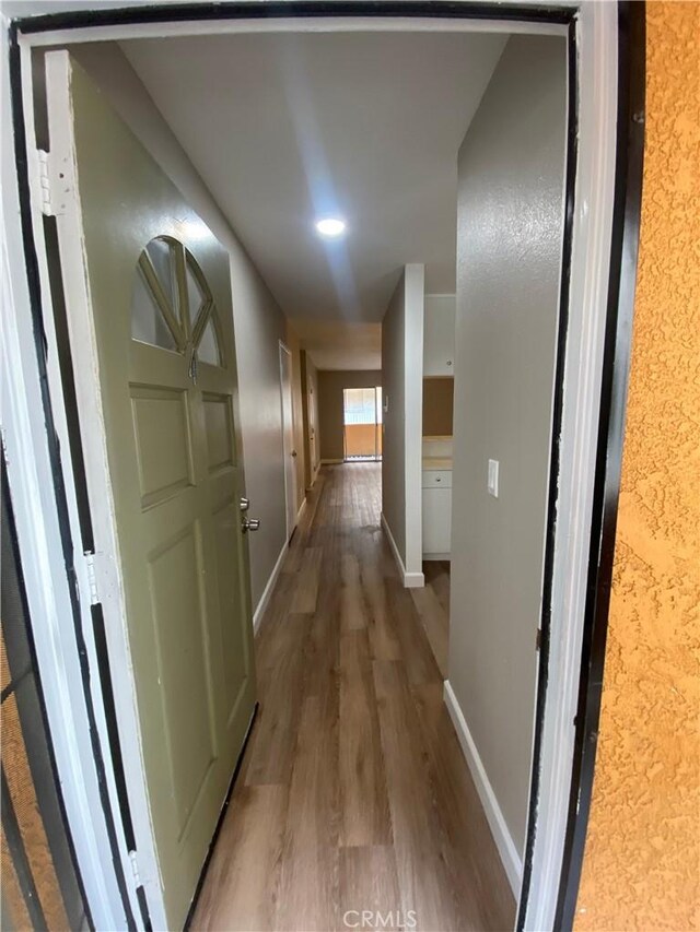 1061 Dawson Ave, Long Beach, CA 90804 - hallway with wood finished floors and baseboards