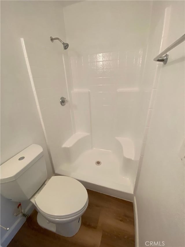 1061 Dawson Ave, Long Beach, CA 90804 - full bathroom featuring wood finished floors, toilet, and a shower