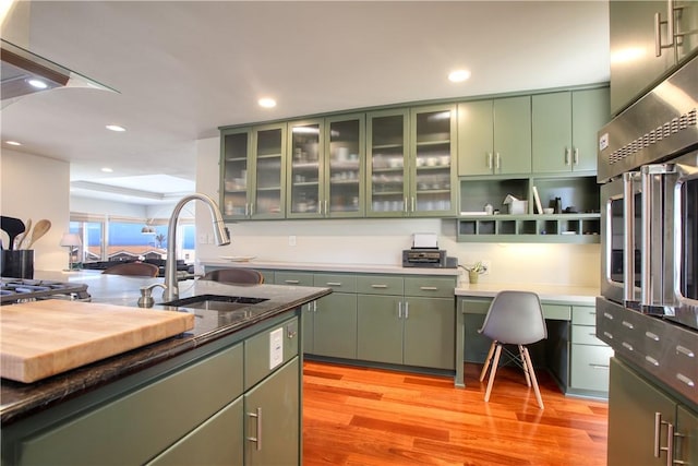 1850 Laurel Pl, Cambria, CA 93428 - kitchen with green cabinetry, a sink, oven, light wood-type flooring, and recessed lighting