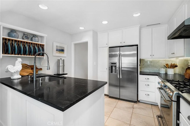 69 Cloudcrest, Aliso Viejo, CA 92656 - kitchen with appliances with stainless steel finishes, a sink, range hood, light tile patterned floors, and decorative backsplash