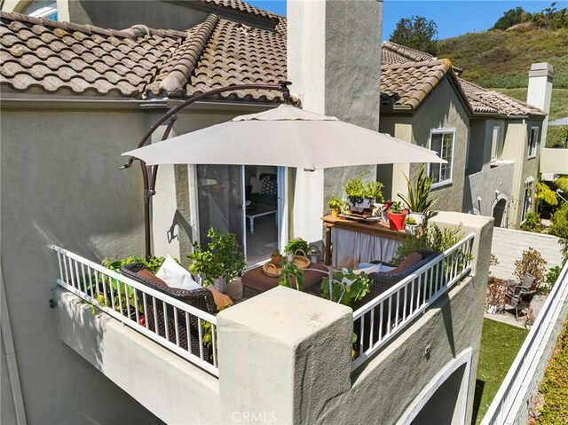 69 Cloudcrest, Aliso Viejo, CA 92656 - back of property featuring a chimney, a tile roof, and stucco siding