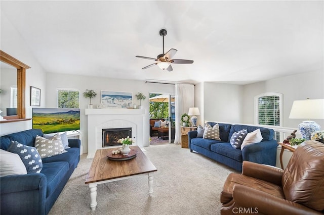 69 Cloudcrest, Aliso Viejo, CA 92656 - living area featuring carpet floors, healthy amount of natural light, a ceiling fan, a fireplace, and lofted ceiling