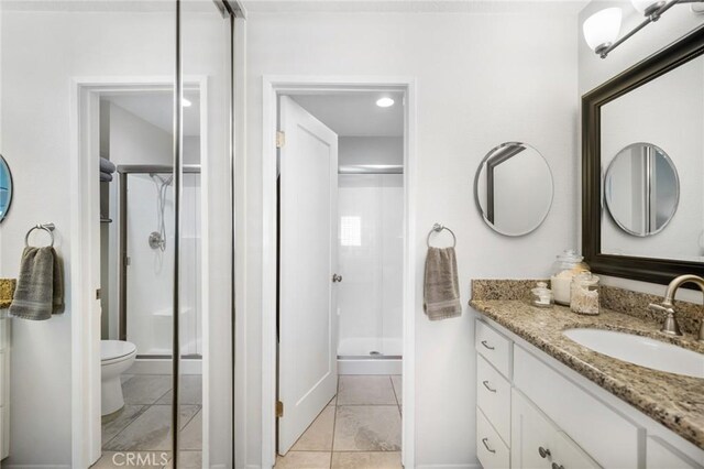 69 Cloudcrest, Aliso Viejo, CA 92656 - bathroom with a stall shower, vanity, toilet, baseboards, and tile patterned floors