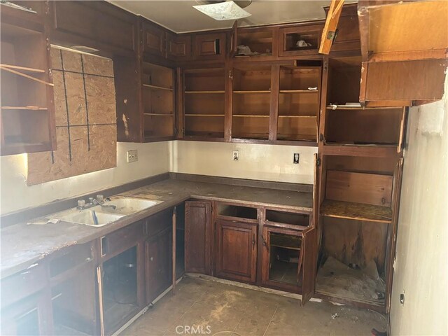 482 E Smith St, Long Beach, CA 90805 - kitchen featuring a sink, open shelves, and dark brown cabinets