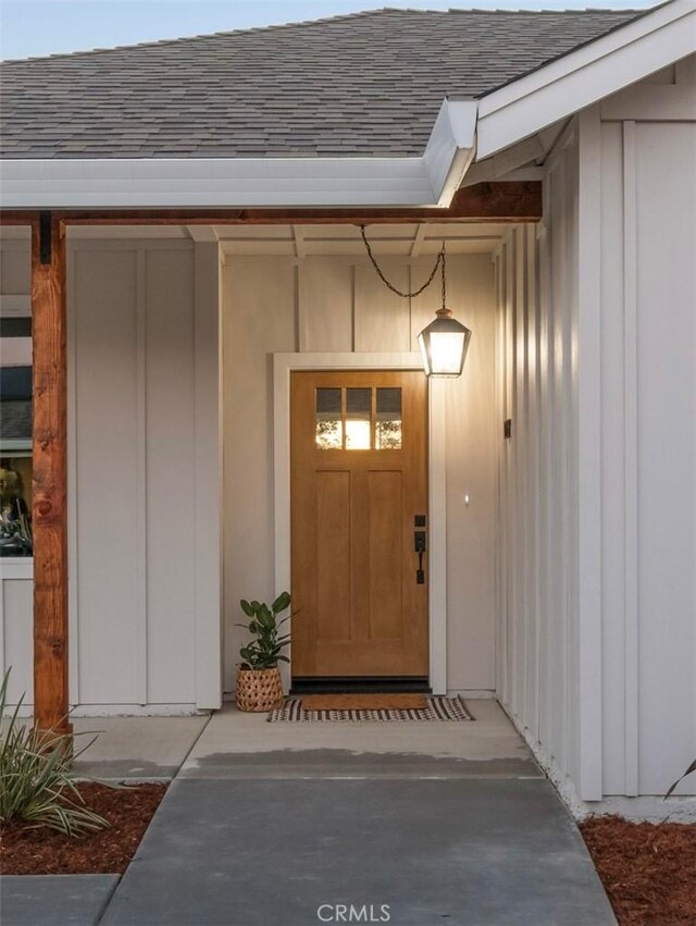 2822 Mariposa Ave, Chico, CA 95973 - doorway to property featuring a shingled roof and board and batten siding