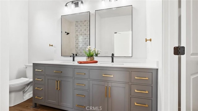 2822 Mariposa Ave, Chico, CA 95973 - bathroom featuring toilet, double vanity, and wood finished floors