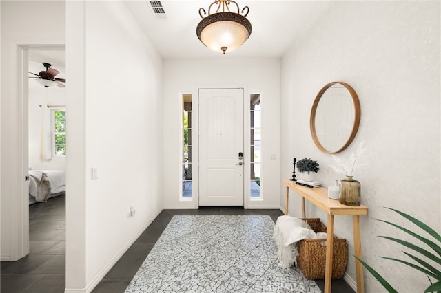 4699 S Moneta Privado, Ontario, CA 91761 - entryway featuring dark tile patterned floors and ceiling fan