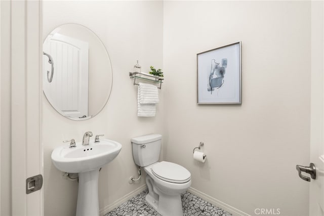 4699 S Moneta Privado, Ontario, CA 91761 - bathroom with toilet, baseboards, a sink, and tile patterned flooring