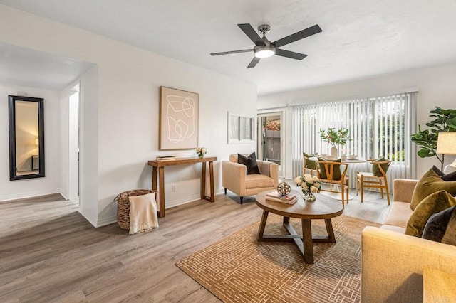 2929 Fire Mountain Dr Unit 9, Oceanside, CA 92054 - living room with light wood-type flooring, a ceiling fan, and baseboards