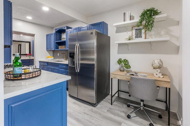2929 Fire Mountain Dr Unit 9, Oceanside, CA 92054 - kitchen featuring open shelves, stainless steel fridge, blue cabinetry, light wood-type flooring, and recessed lighting