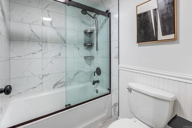 2929 Fire Mountain Dr Unit 9, Oceanside, CA 92054 - full bathroom with shower / bath combination with glass door, toilet, and a wainscoted wall