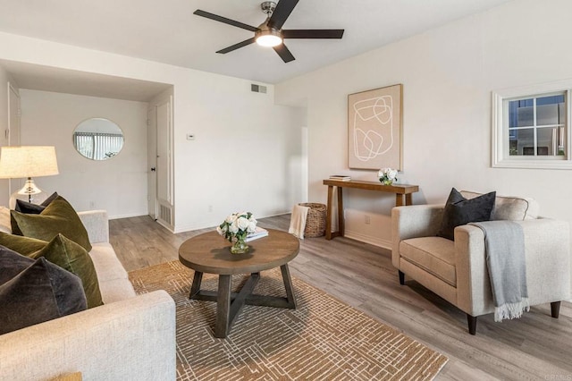 2929 Fire Mountain Dr Unit 9, Oceanside, CA 92054 - living room featuring wood finished floors, a ceiling fan, and baseboards