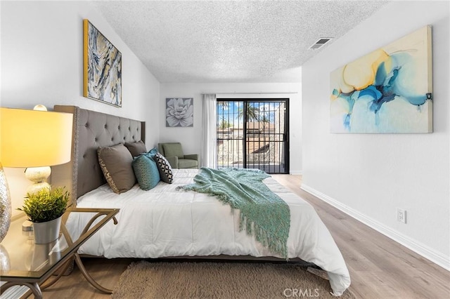 321 N Lincoln Ave Unit B, Monterey Park, CA 91755 - bedroom with a textured ceiling and wood finished floors