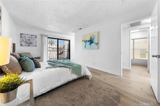 321 N Lincoln Ave Unit B, Monterey Park, CA 91755 - bedroom with a textured ceiling and wood finished floors