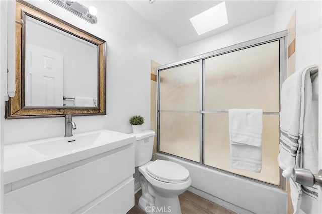 321 N Lincoln Ave Unit B, Monterey Park, CA 91755 - full bath featuring a skylight, vanity, enclosed tub / shower combo, and wood finished floors