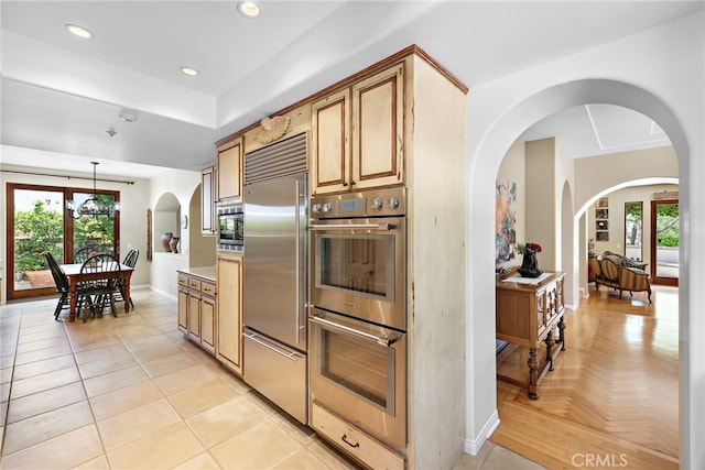 3805 Vista Azul, San Clemente, CA 92672 - kitchen featuring built in appliances, arched walkways, baseboards, decorative light fixtures, and recessed lighting