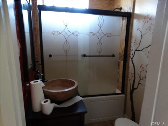 full bath with bath / shower combo with glass door and toilet