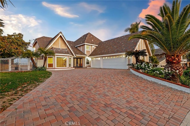 3808 E Summitridge Ln, Orange, CA 92867 - view of front facade featuring french doors, a garage, decorative driveway, fence, and stucco siding