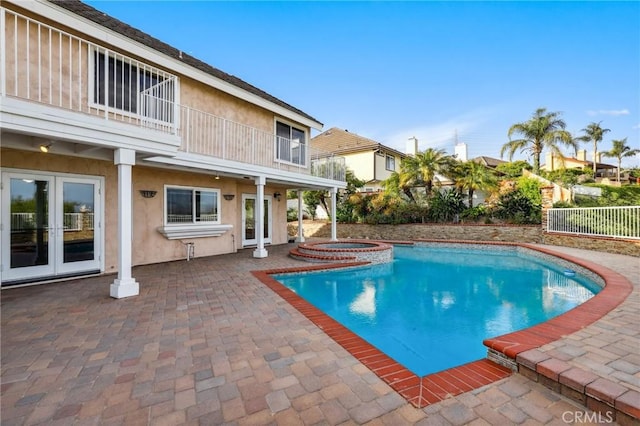 3808 E Summitridge Ln, Orange, CA 92867 - view of swimming pool with french doors, a patio, fence, and a pool with connected hot tub