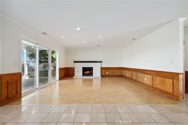 3808 E Summitridge Ln, Orange, CA 92867 - unfurnished living room with a wainscoted wall, ornamental molding, a fireplace, recessed lighting, and light tile patterned flooring