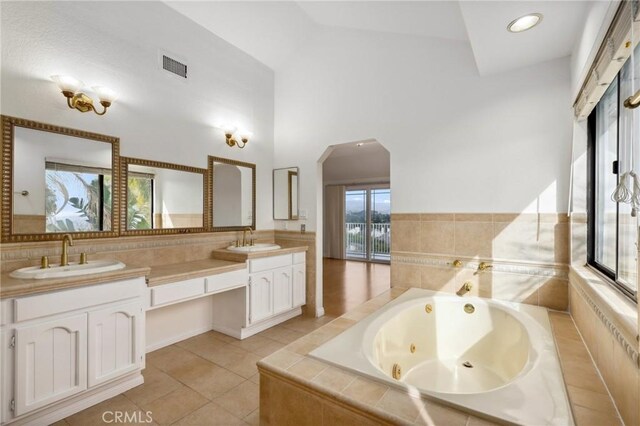 3808 E Summitridge Ln, Orange, CA 92867 - full bath featuring a whirlpool tub, double vanity, tile patterned floors, and a towering ceiling