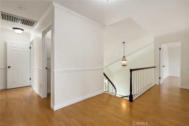 3808 E Summitridge Ln, Orange, CA 92867 - hallway with an upstairs landing, wood finished floors, baseboards, and ornamental molding