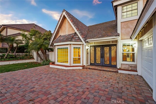 3808 E Summitridge Ln, Orange, CA 92867 - rear view of property featuring french doors and stucco siding