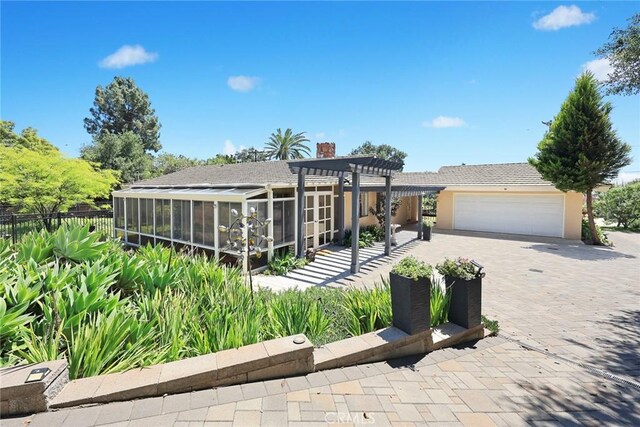 152 Spinks Canyon Rd, Bradbury, CA 91008 - view of front of home with a pergola, a sunroom, a garage, a chimney, and decorative driveway