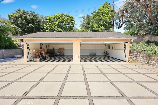 detached garage with fence