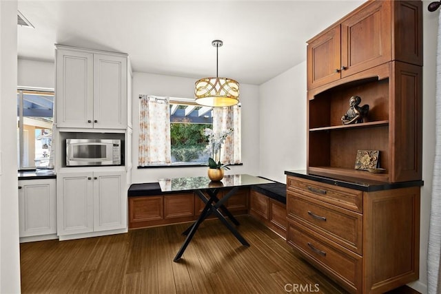 152 Spinks Canyon Rd, Bradbury, CA 91008 - kitchen featuring stainless steel microwave, dark wood-type flooring, dark countertops, and plenty of natural light